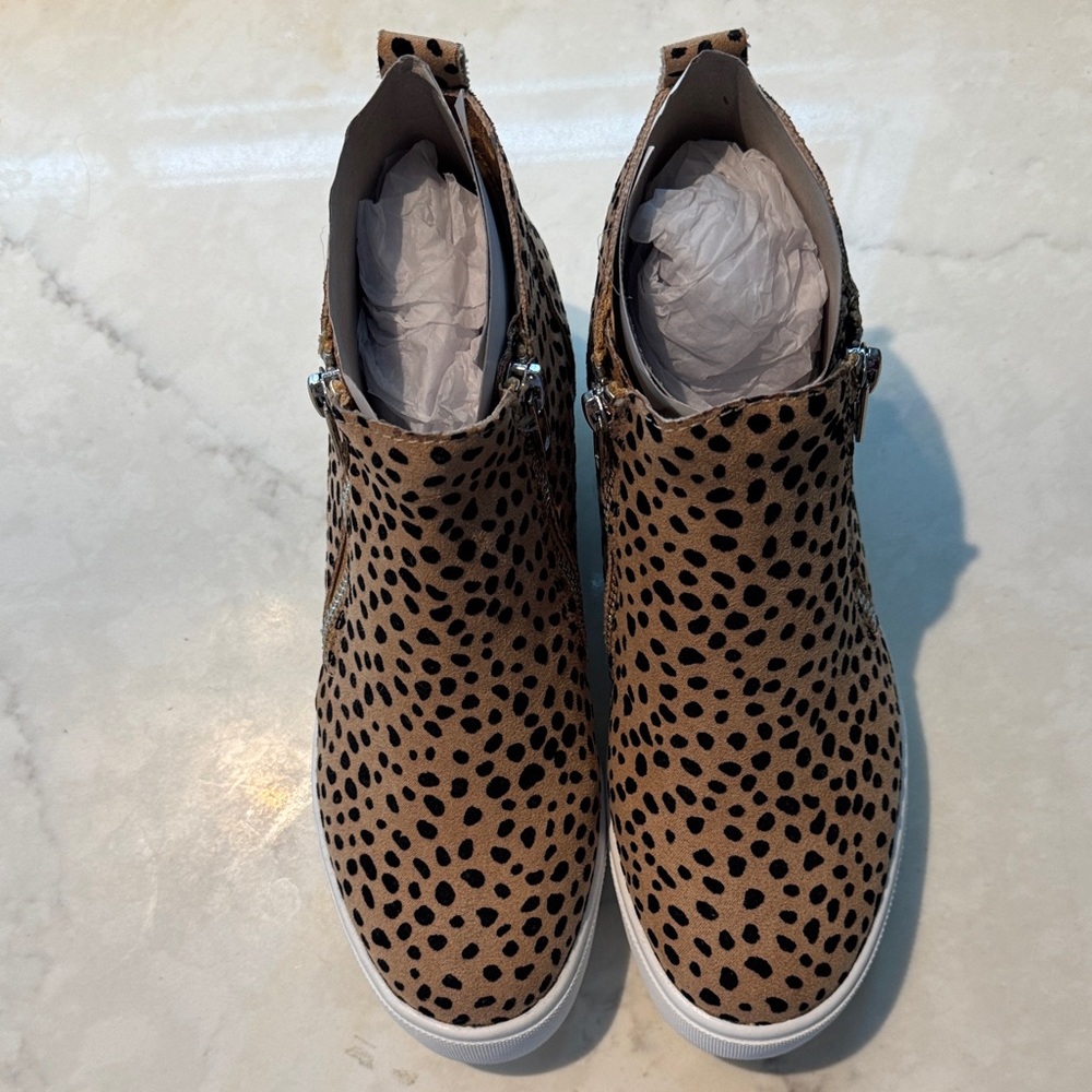 NWOT Leopard Print platform slip on sneakers with silver zippers. NEW!